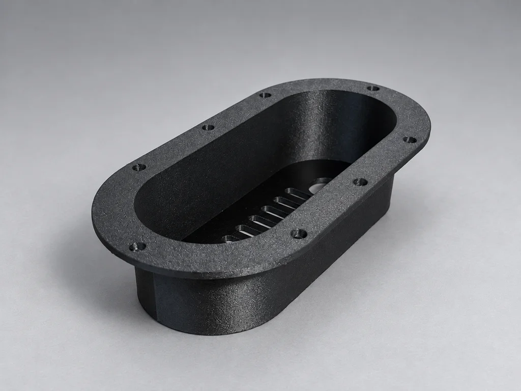 Black 3D-printed belt guard cover with flange mounting holes